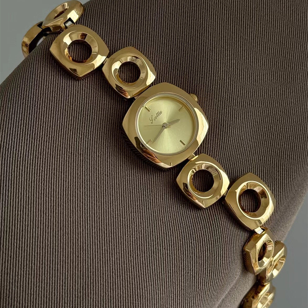 MONTRE SCULPTÉE DORÉE FEMME